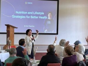 Dr Avi Charlston delivering a health and wellness presentation to the community